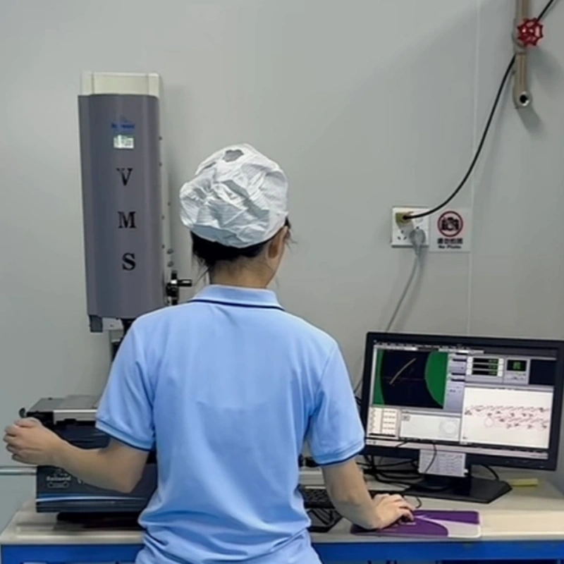 Quality control engineer performing dimensional inspection on rapid silicone prototype samples.